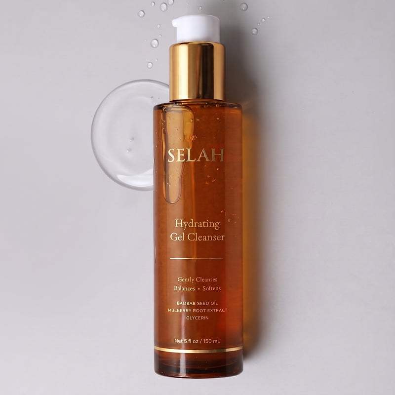 SELAH Hydrating Gel Cleanser in an amber glass bottle with a gold pump, beside a swatch of clear gel